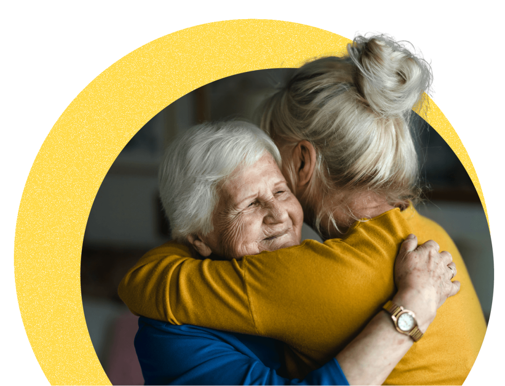 Younger woman hugging older woman
