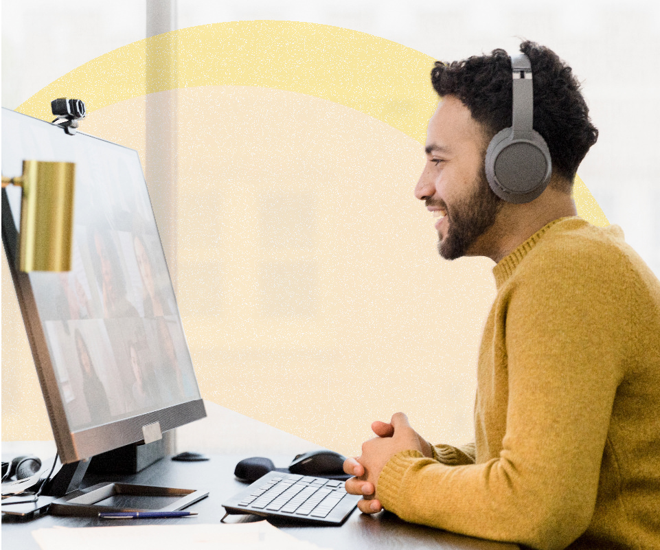 Man virtually chatting with colleagues from home office